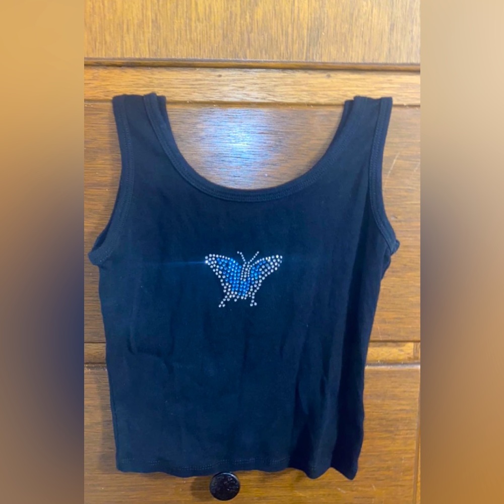 This is a cute black crop top shirt, with a gem butterfly in the middle.